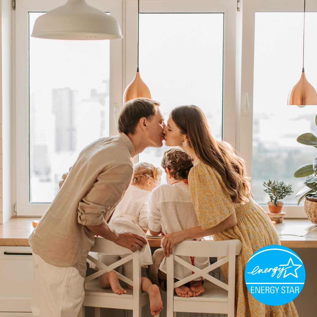 Family in Houston looking out a picture window.